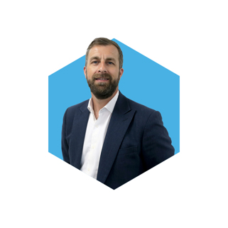 Portrait of Chris Ford within a blue hexagon.